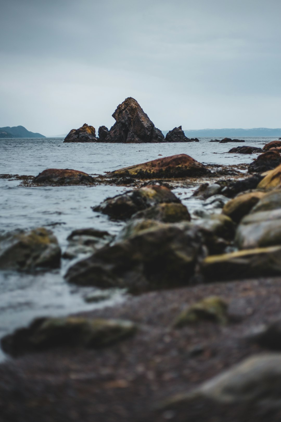 brown rock formation on sea during daytime