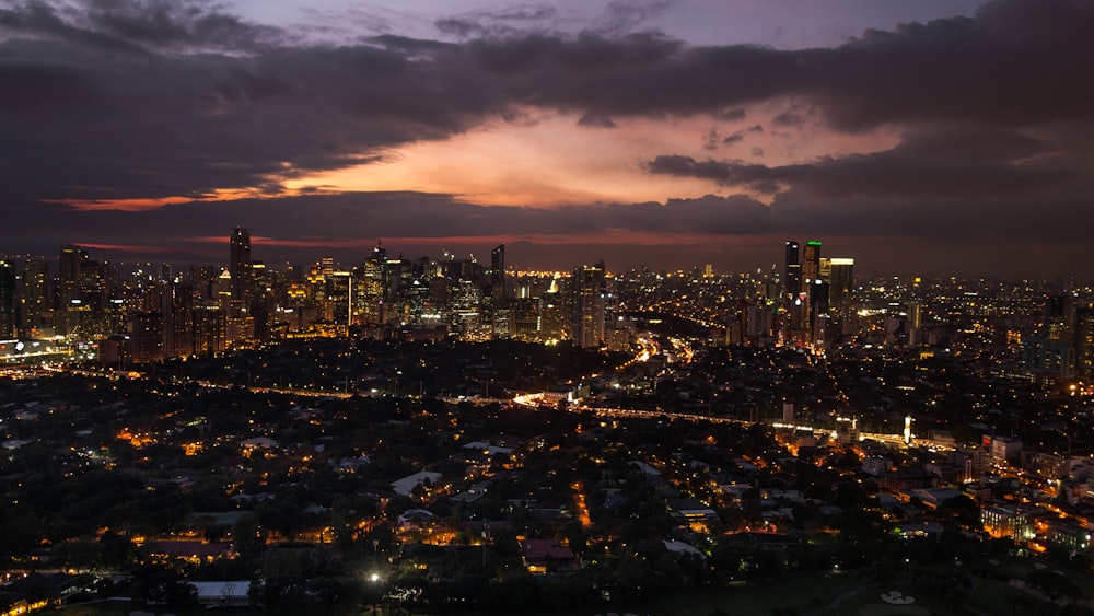 city with high rise buildings during night time