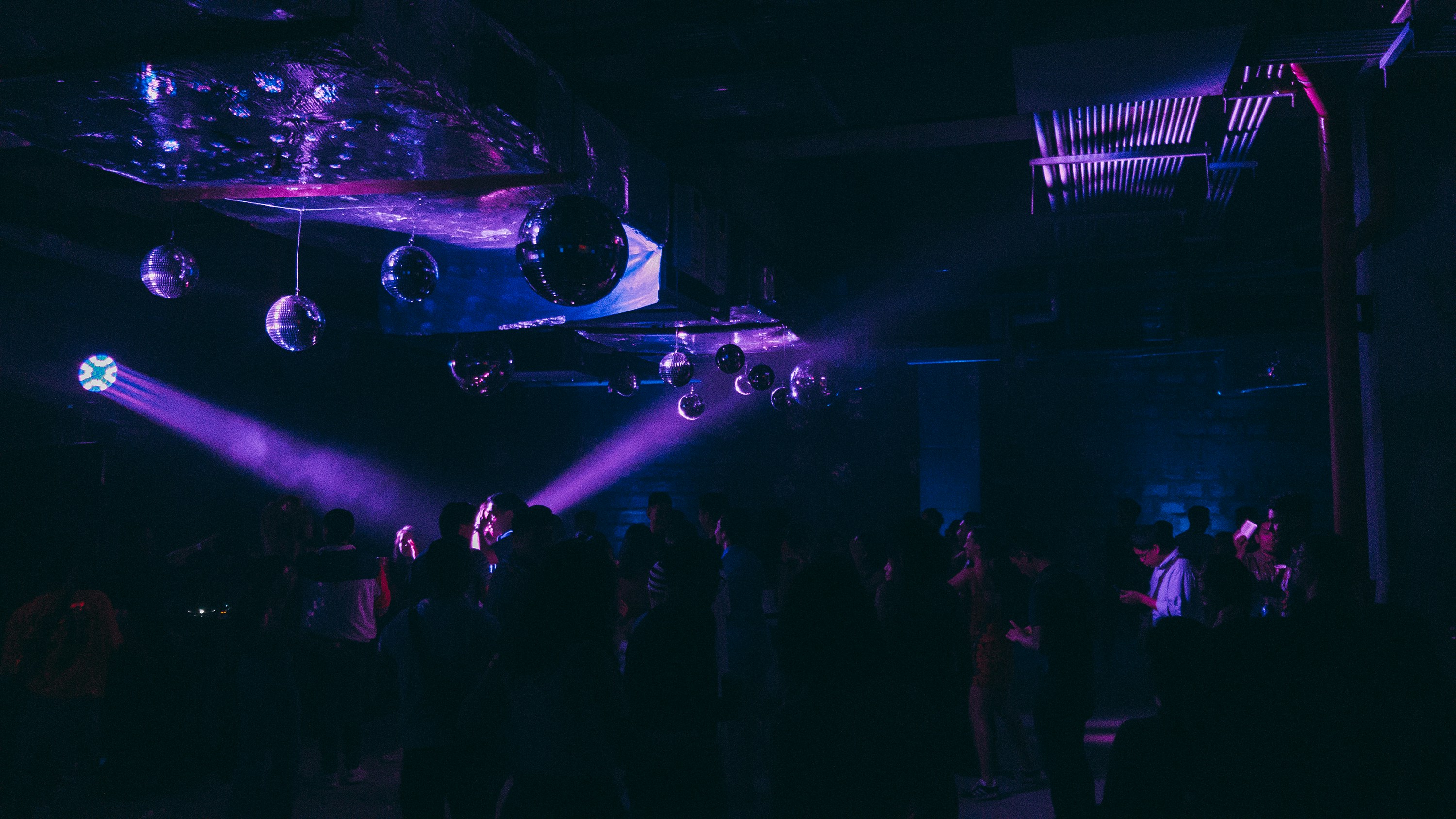 people standing on stage with lights