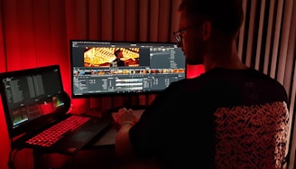 man in black shirt using computer