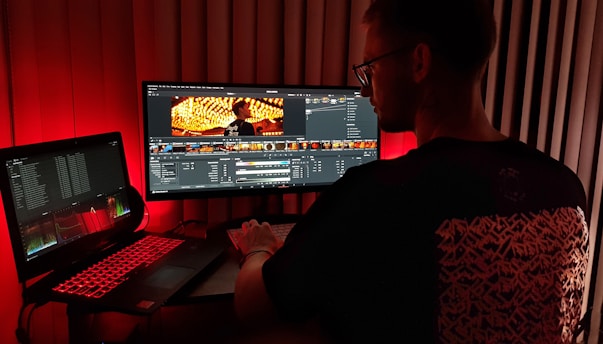 man in black shirt using computer