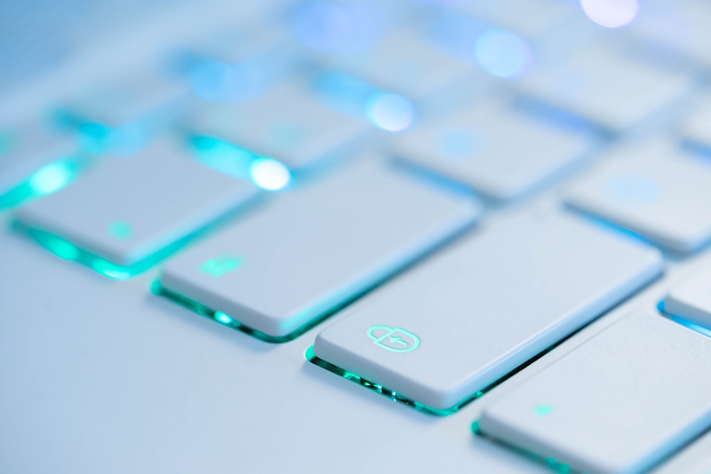 white and blue computer keyboard