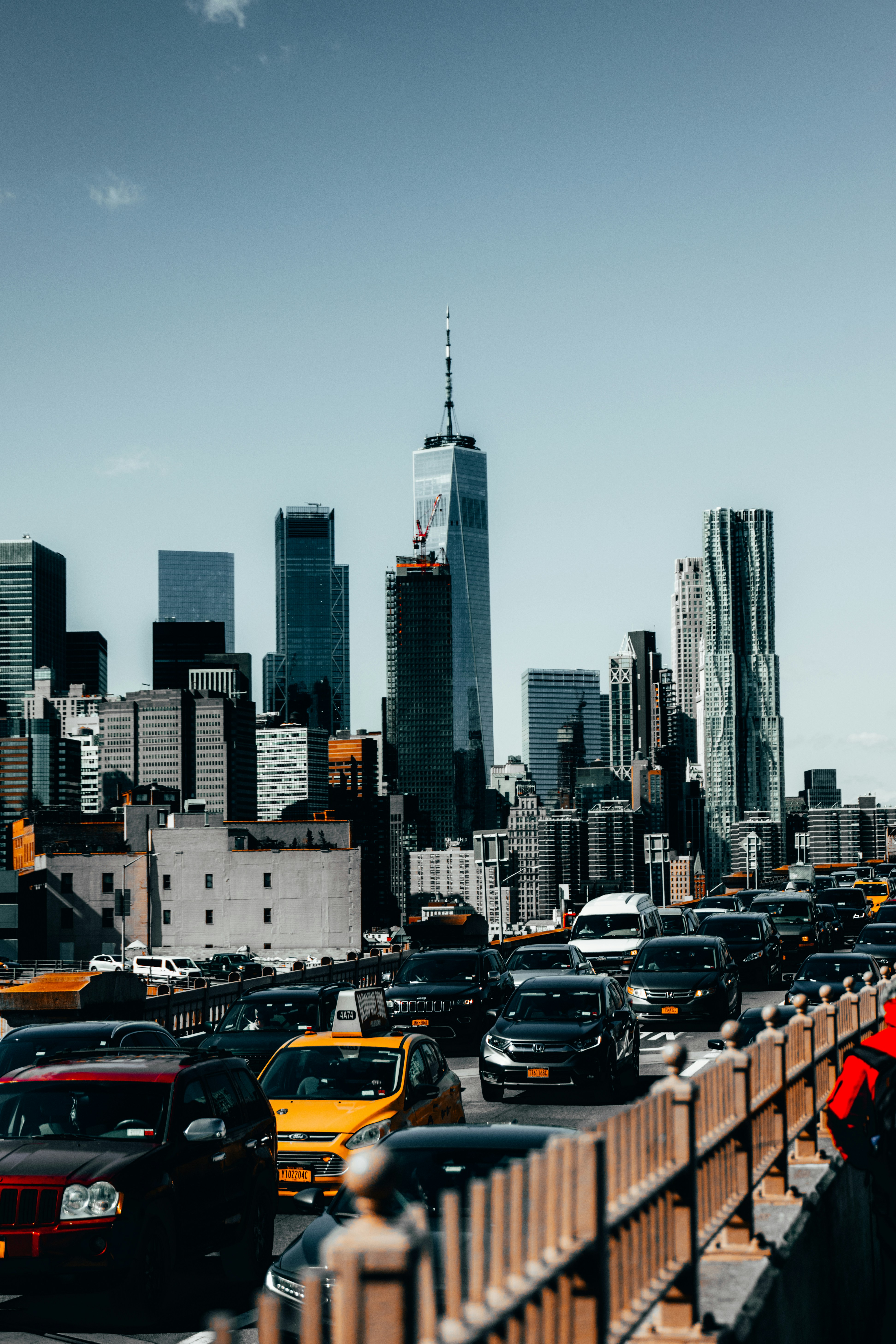 cars on road near city buildings during daytime
