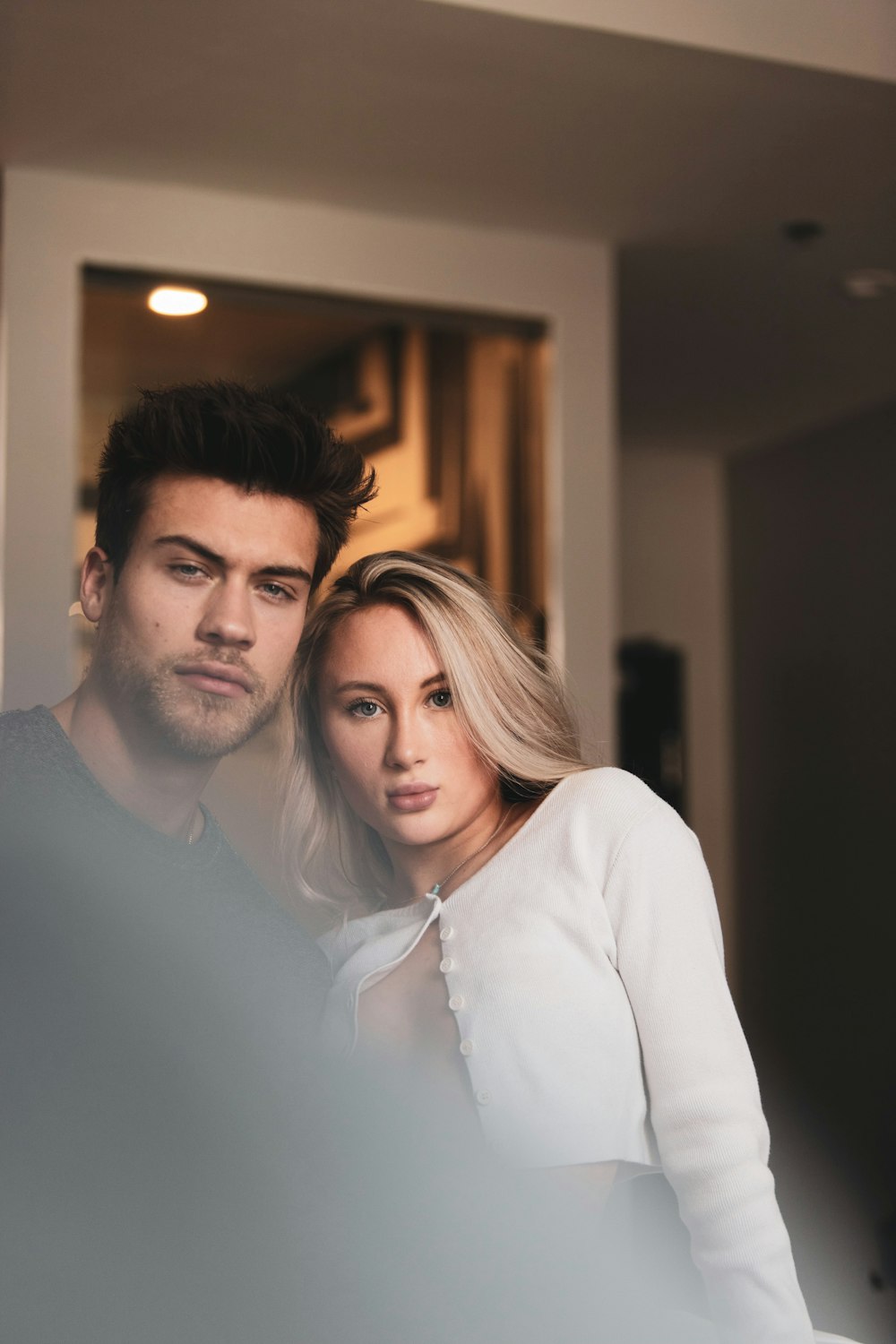 man in white dress shirt beside woman in white long sleeve shirt