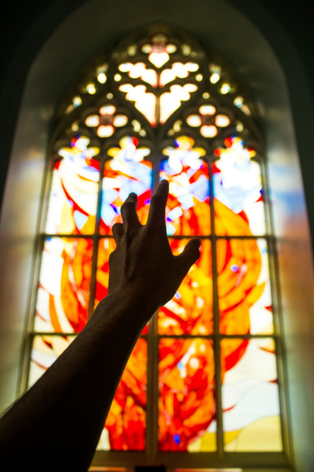 persons hand on window