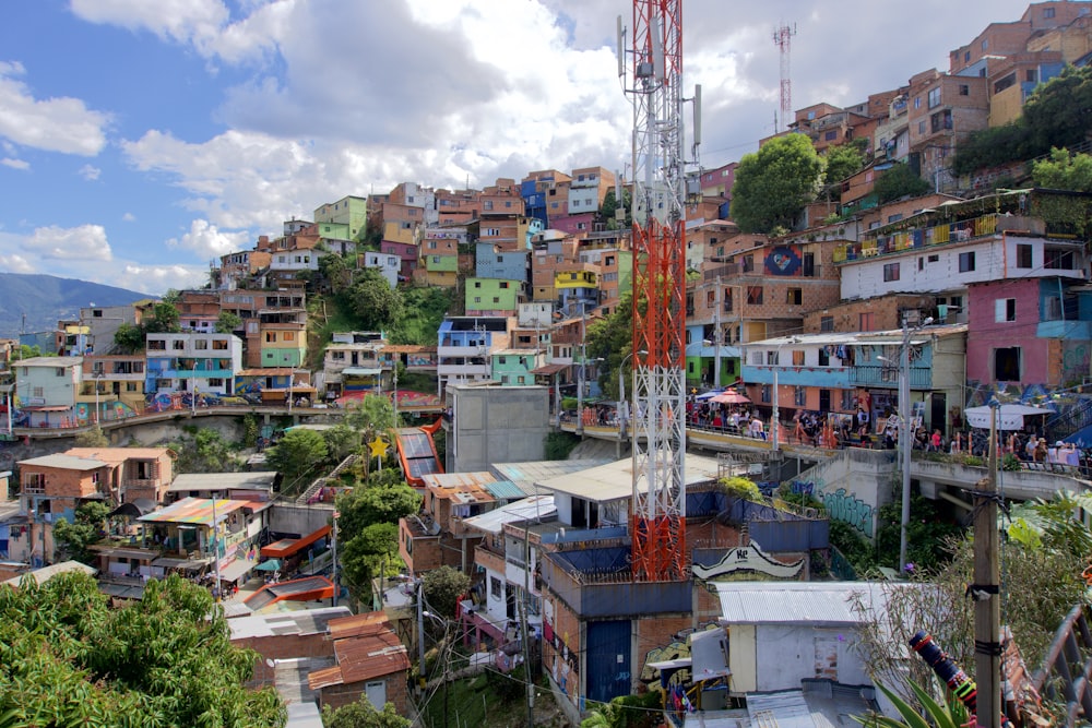 orange and white crane near buildings during daytime