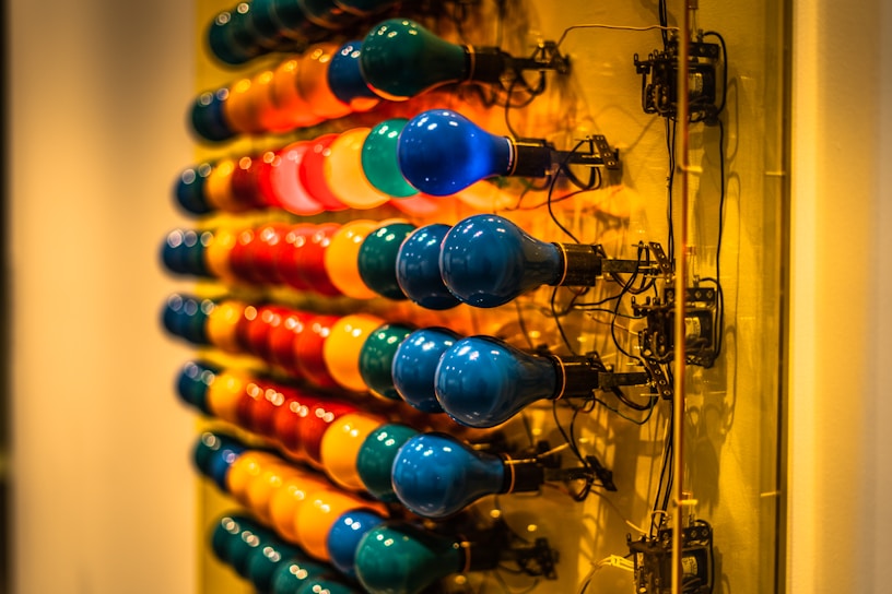 A vibrant display of various electric products including bulbs and cables.
