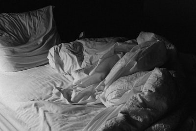 grayscale photo of bed linen blanket teams background