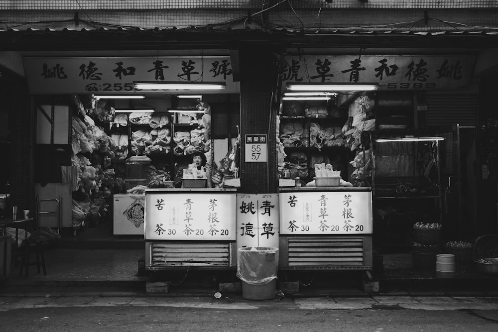 grayscale photo of store front