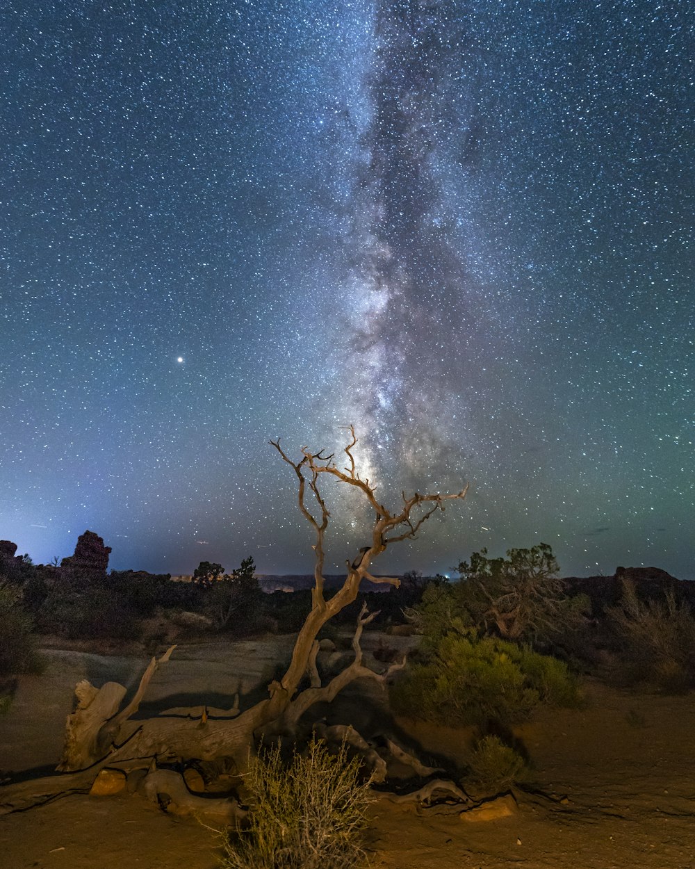 brown rocky mountain under blue sky during night time