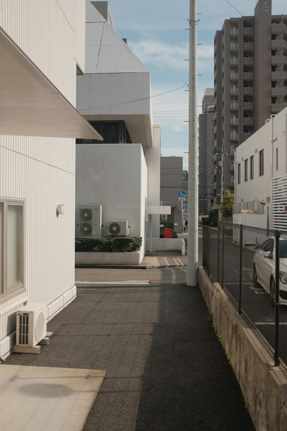 white concrete building near road during daytime