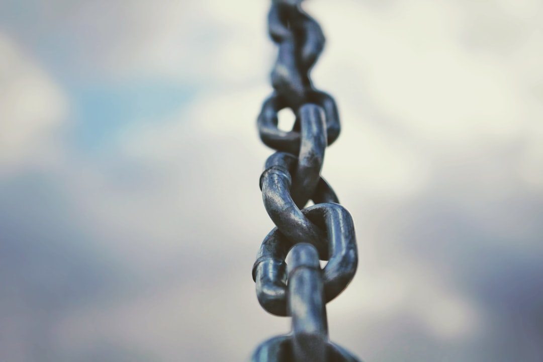 black metal chain in close up photography