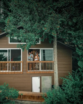 woman in black shirt standing on balcony
