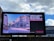 A large billboard displays a public service announcement addressing domestic abuse, featuring an image of a city street lined with historic buildings. The text on the billboard reads: 'Domestic abusers are no longer walking among us. They’re locked inside with their families.'