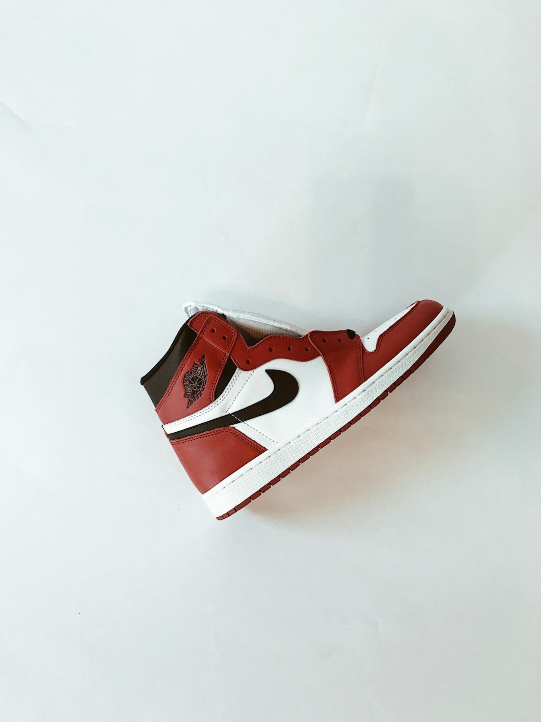 red and white nike shoe