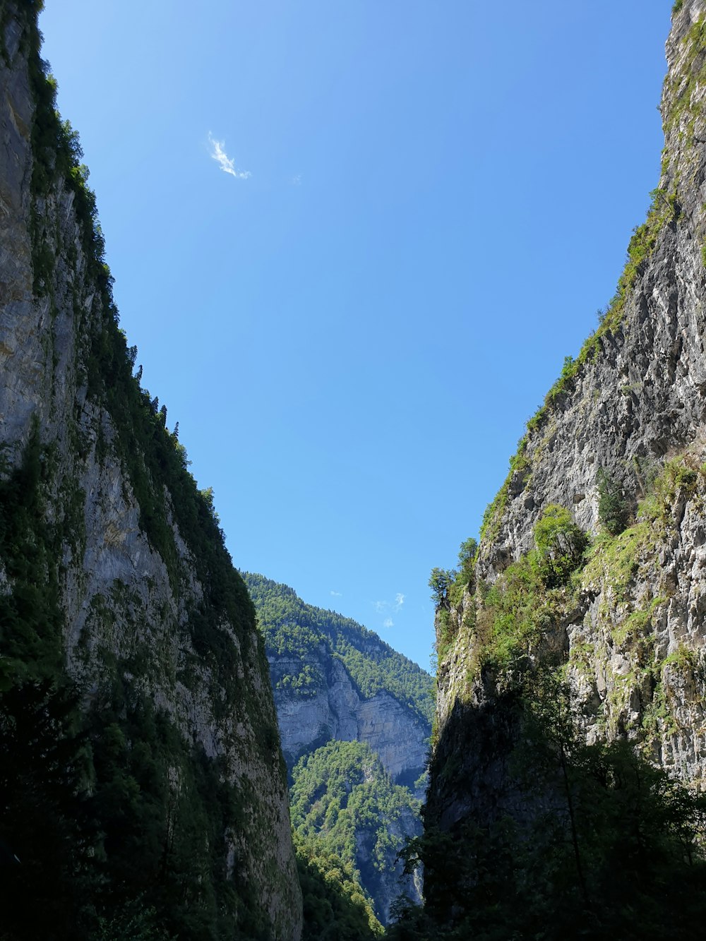 green and gray rocky mountain under blue sky during daytime