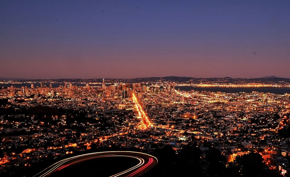 city with high rise buildings during night time