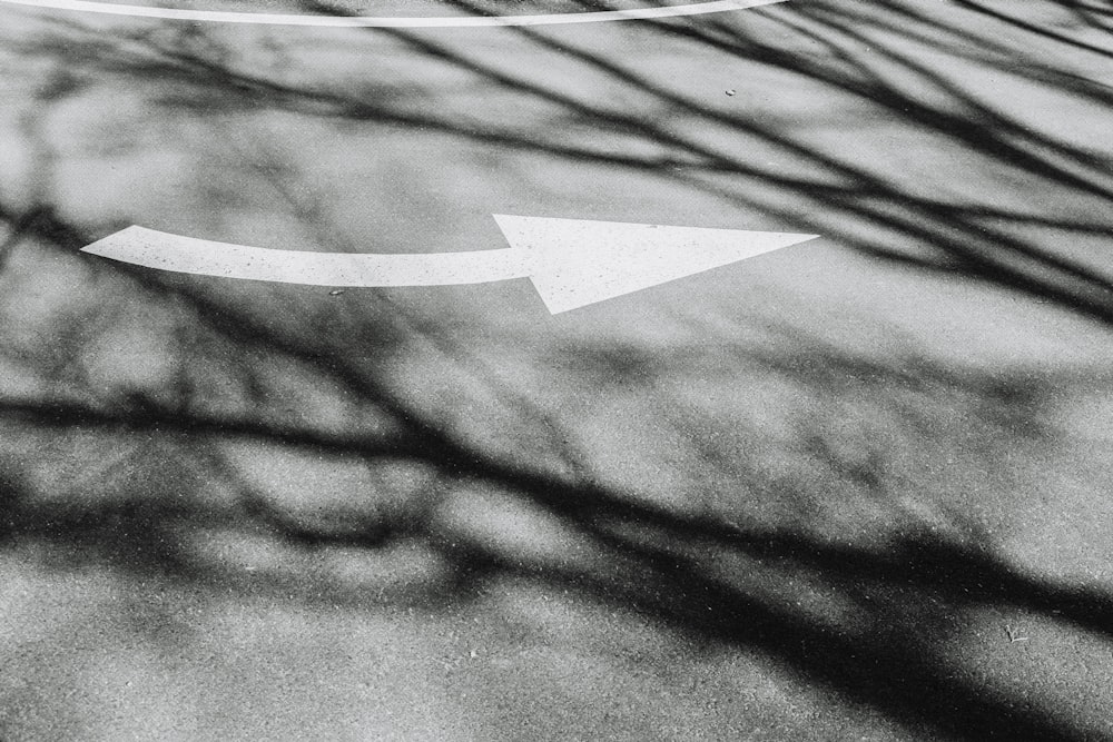 white arrow on gray textile