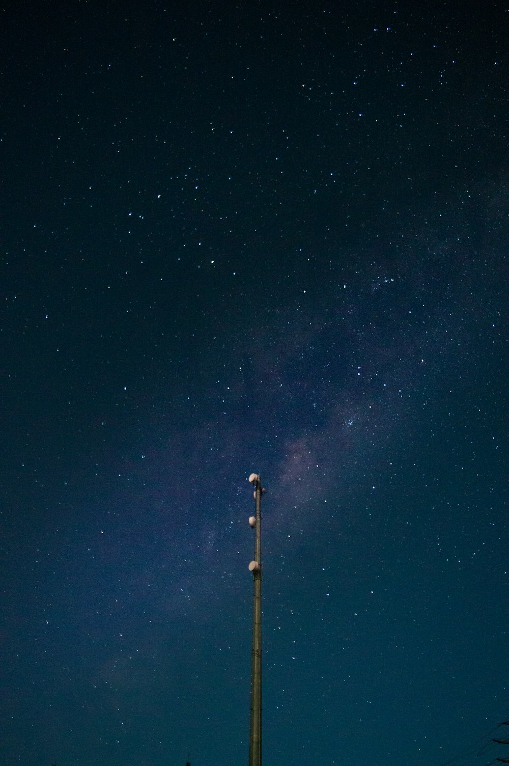 black and white tower under starry night