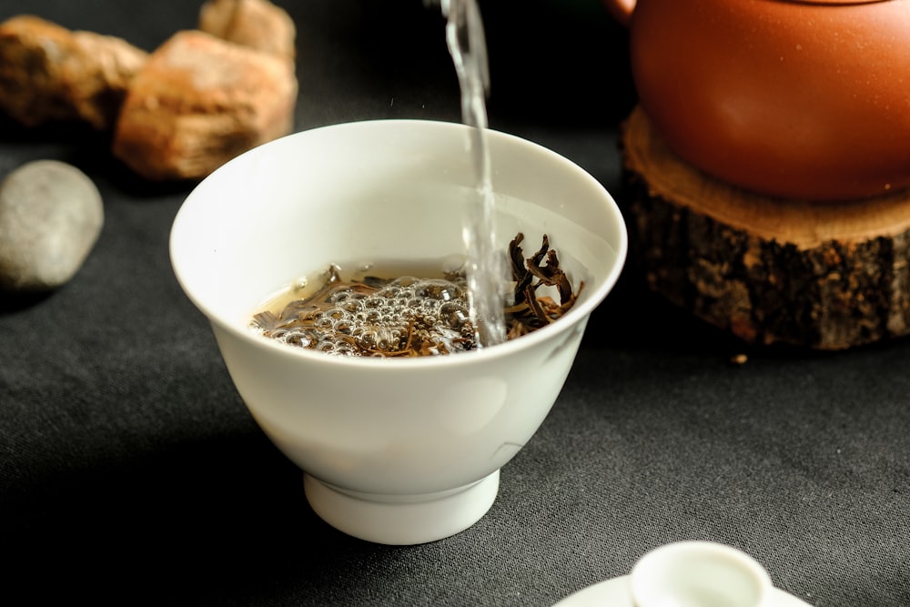 white ceramic bowl with silver spoon