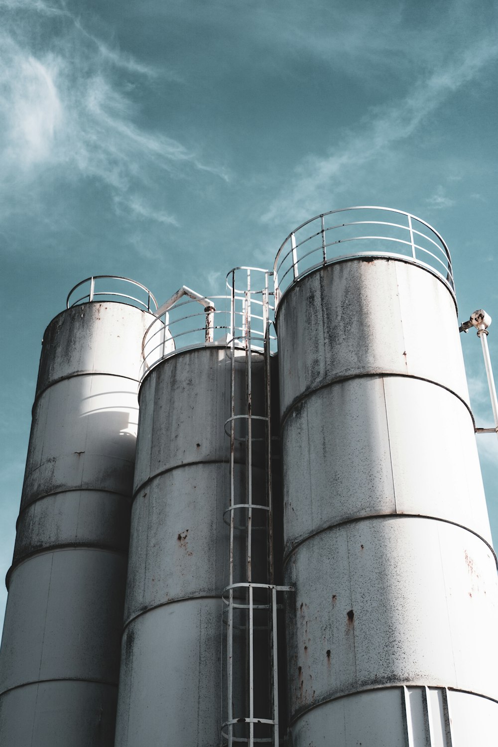 a group of large metal tanks sitting next to each other