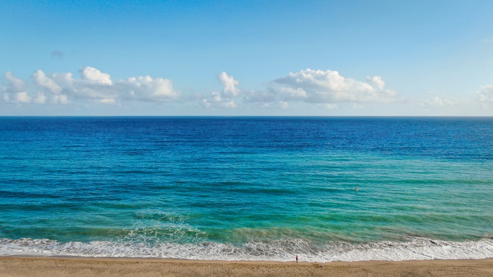 blue sea under blue sky during daytime