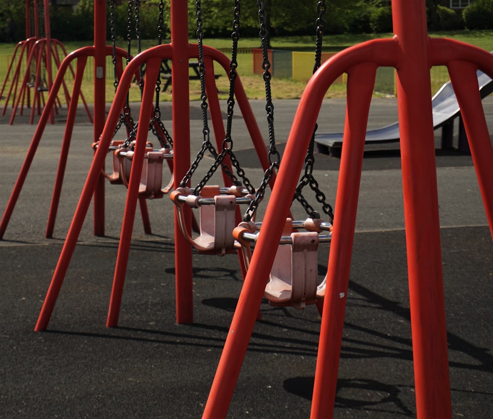 red metal frame on black asphalt road