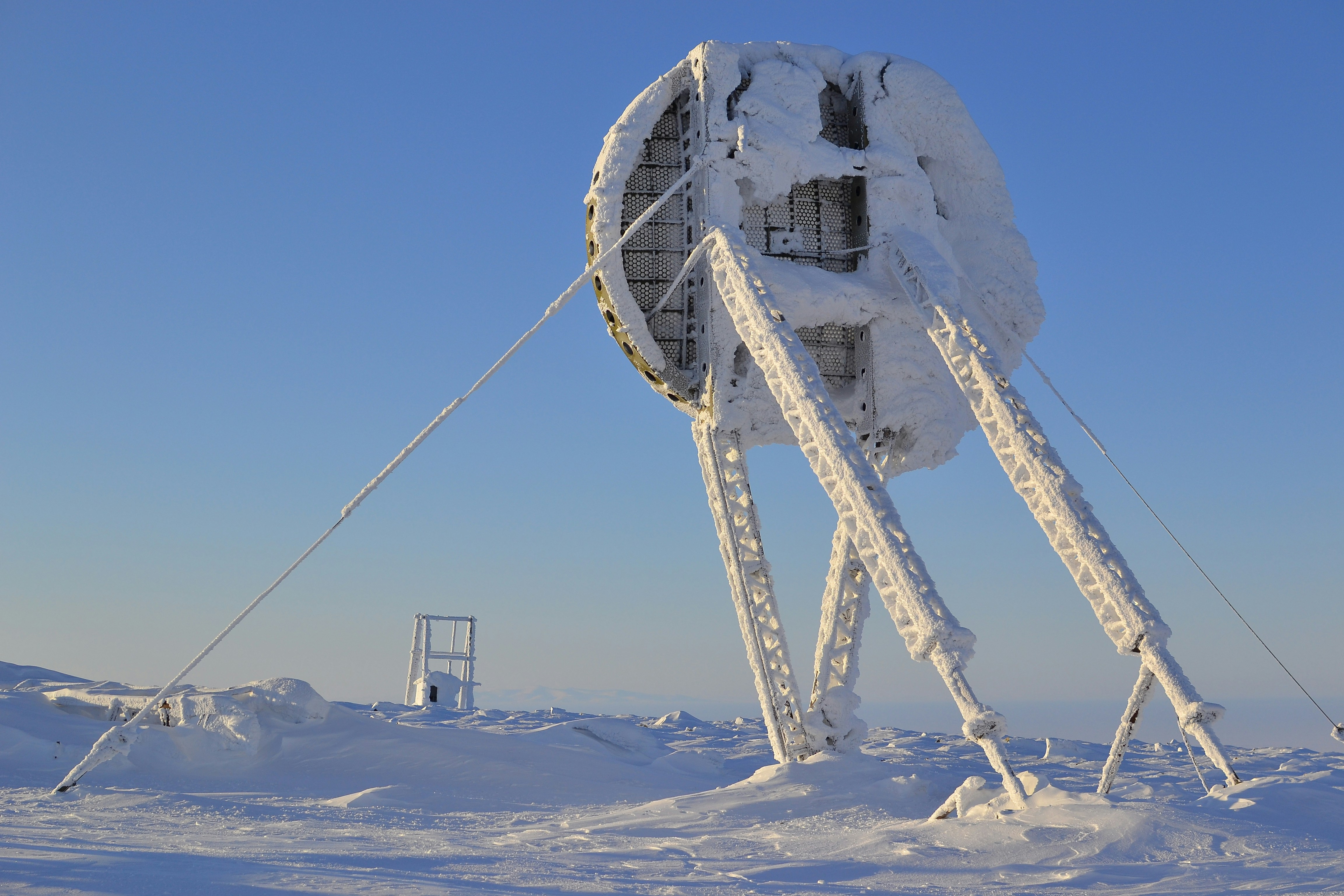 white and gray satellite under blue sky during daytime