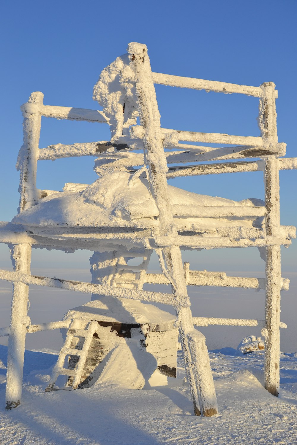 white wooden frame on white sand