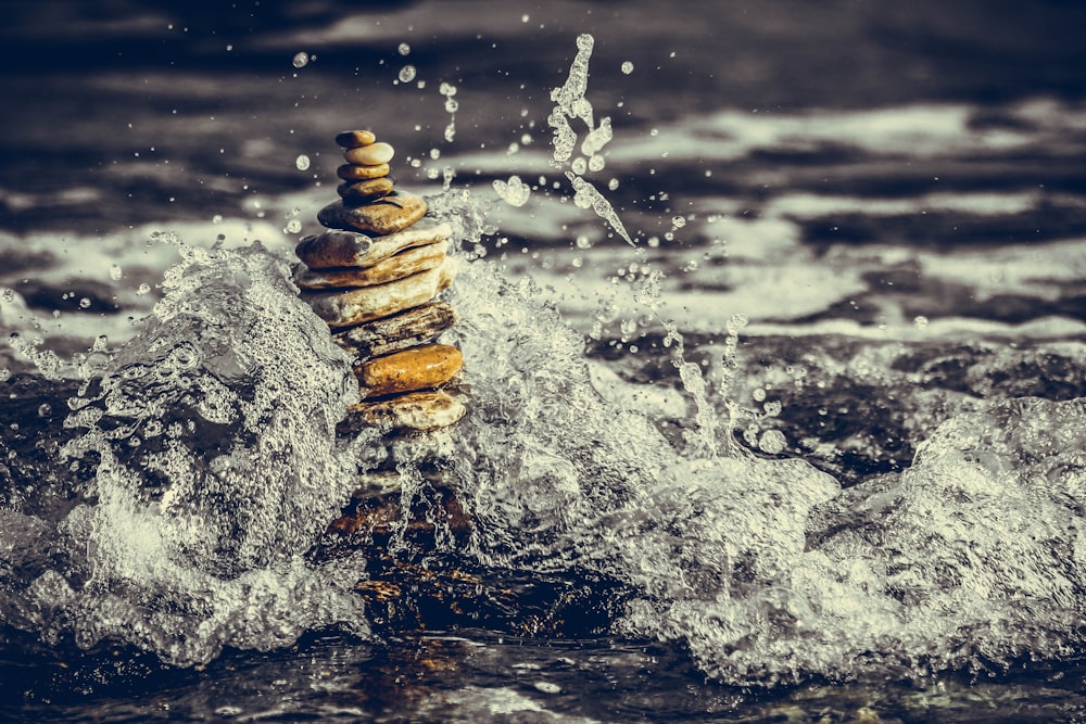 water splash on brown rock