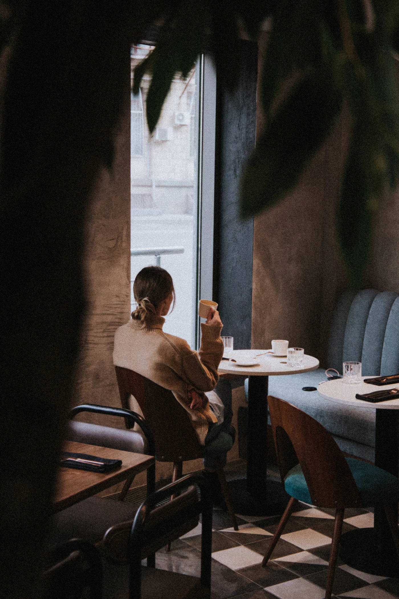 Reading by a cafe window