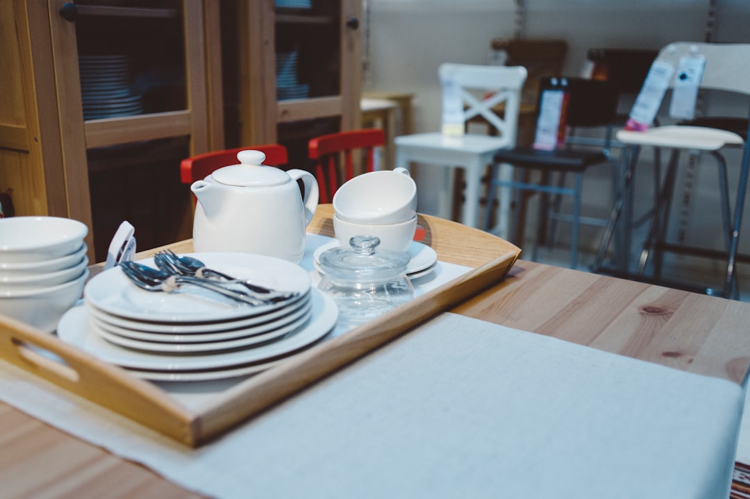 white ceramic mug on white ceramic plate