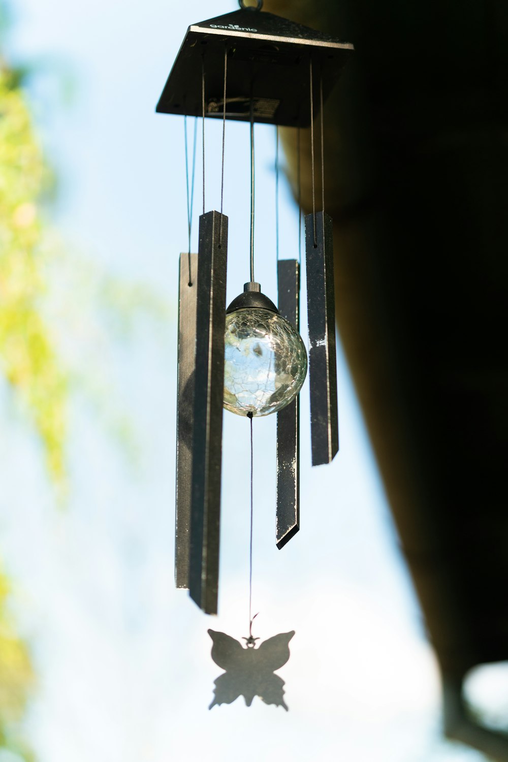 clear glass hanging ball on black metal rack