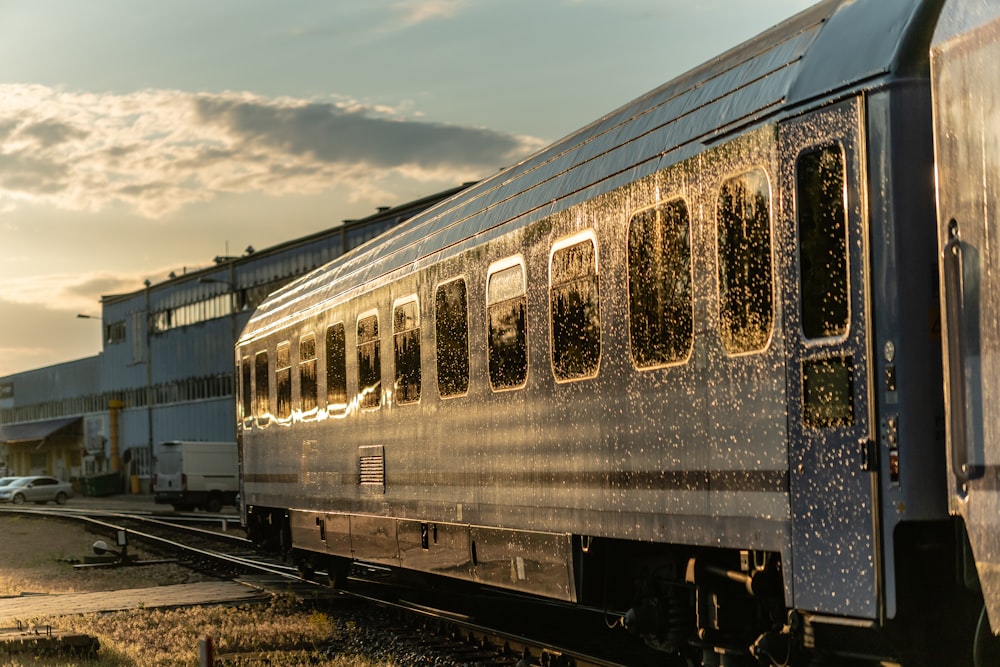 blue and white train under cloudy sky during daytime