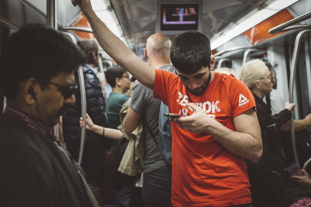 man in orange and white nike crew neck t-shirt