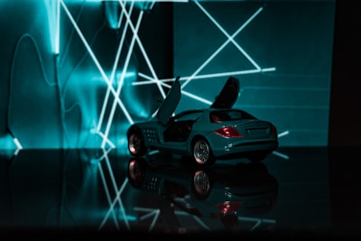 A dynamic holographic display showing a futuristic car model rotating in mid-air.