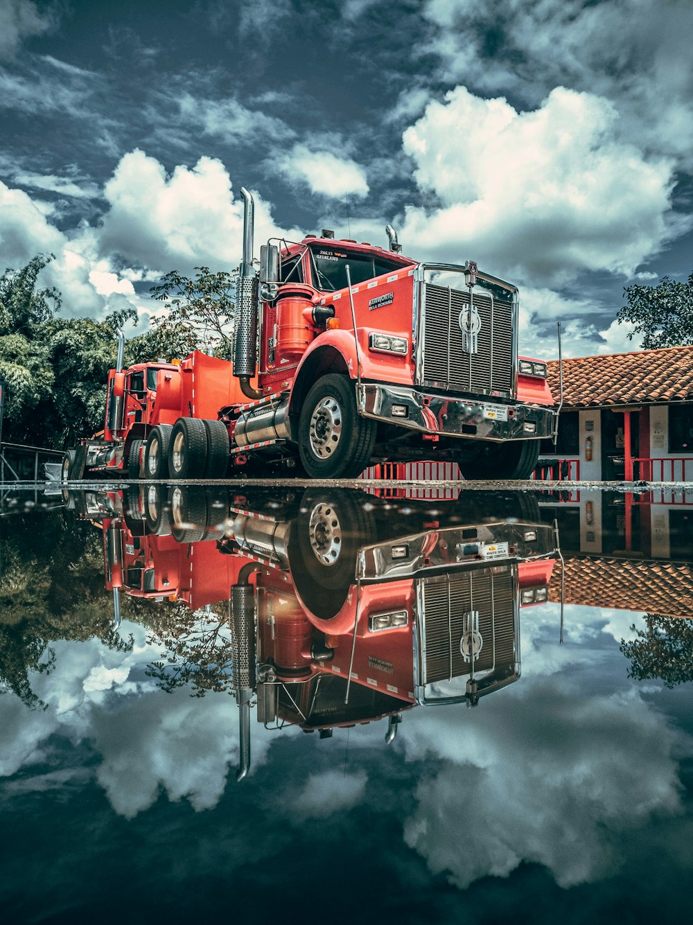 red and black truck on road during daytime