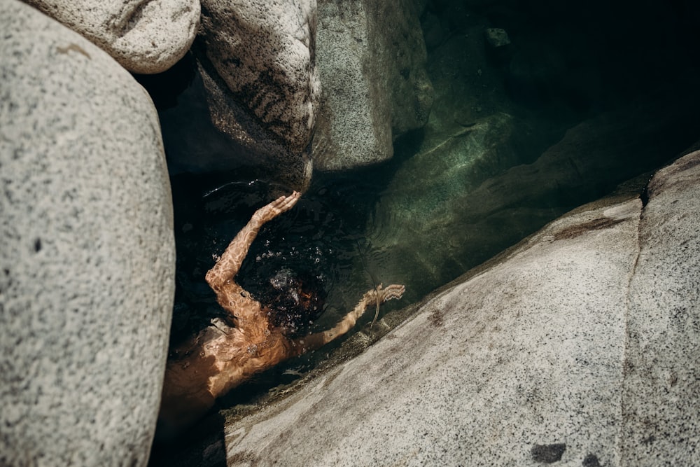 gray rock near body of water