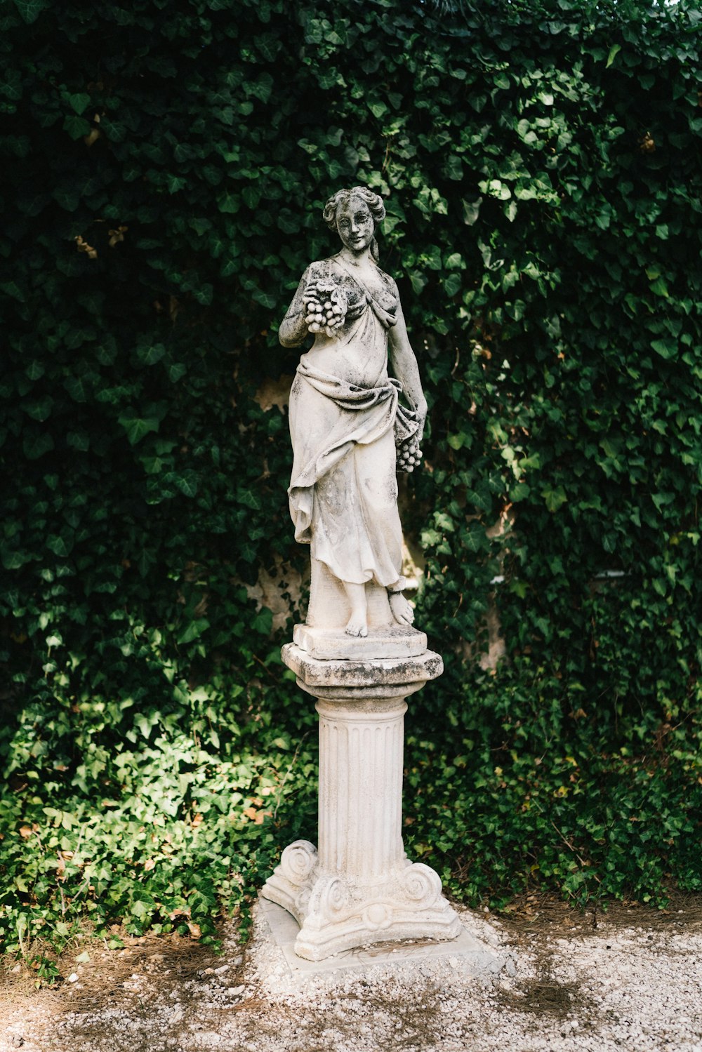 woman in dress concrete statue