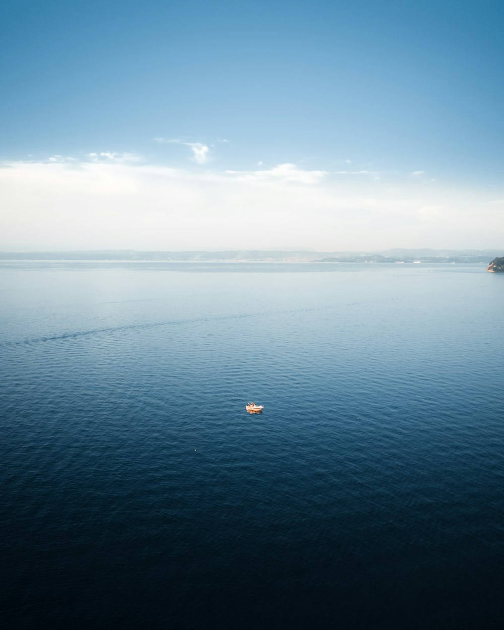 body of water under blue sky during daytime