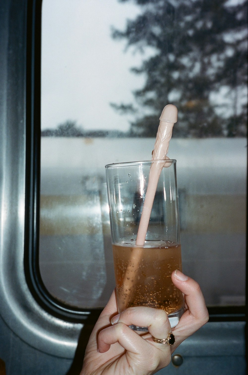 clear drinking glass with brown liquid