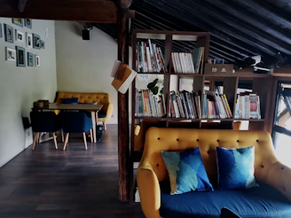 A cozy therapy room with soft blue and yellow accents, inviting comfort and calm.