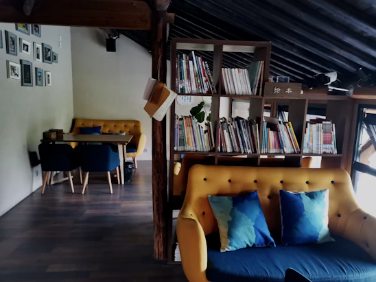 A cozy therapy room with soft blue and yellow accents, inviting comfort and calm.