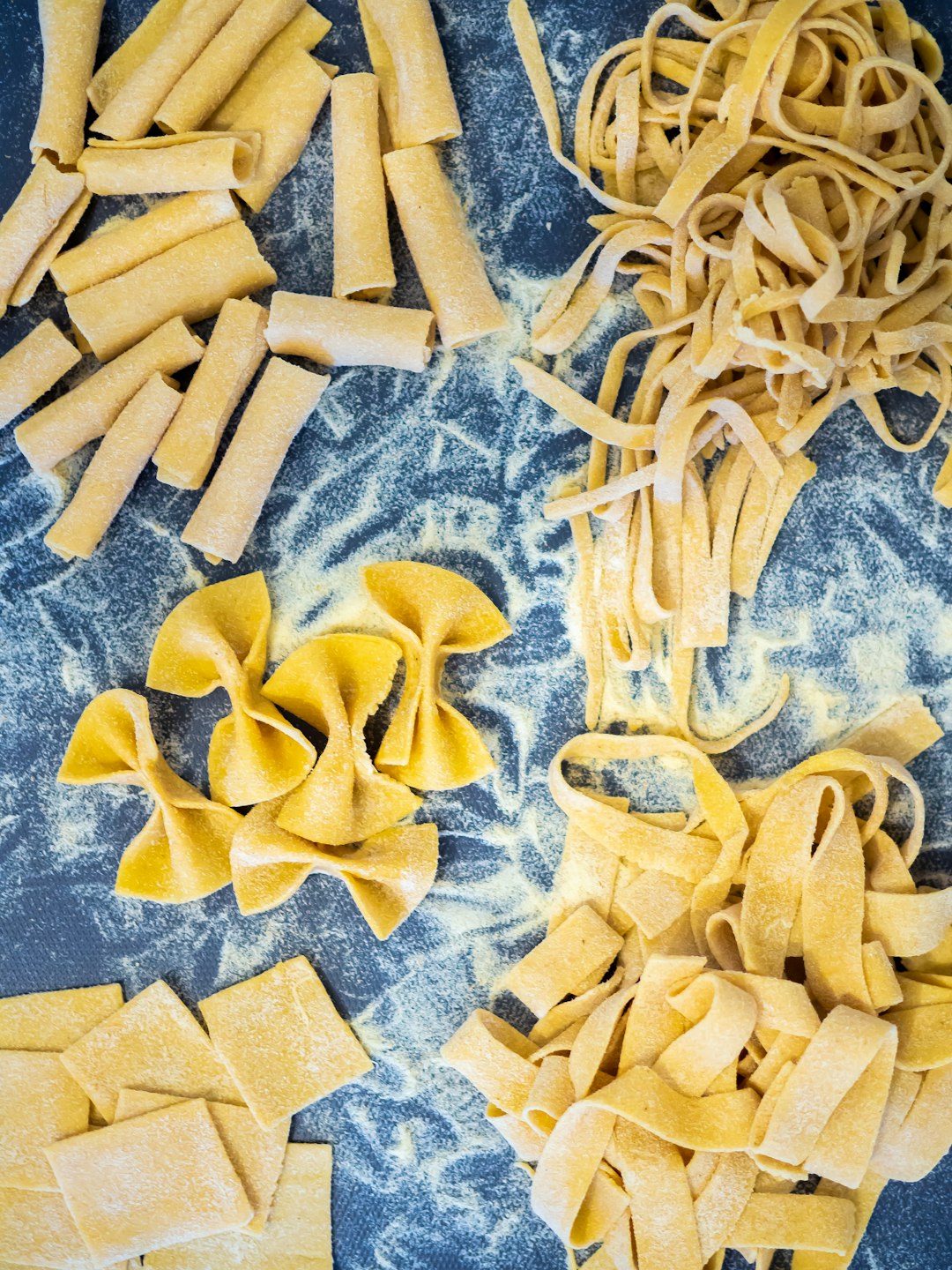 Home made pasta shapes - tagliatelle, farfalle, pappardelle 