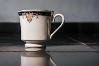 A beautifully designed mug featuring intricate artwork against a soft background.