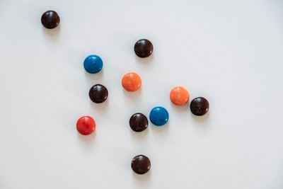 red blue and yellow m ms candies confectionery zoom background