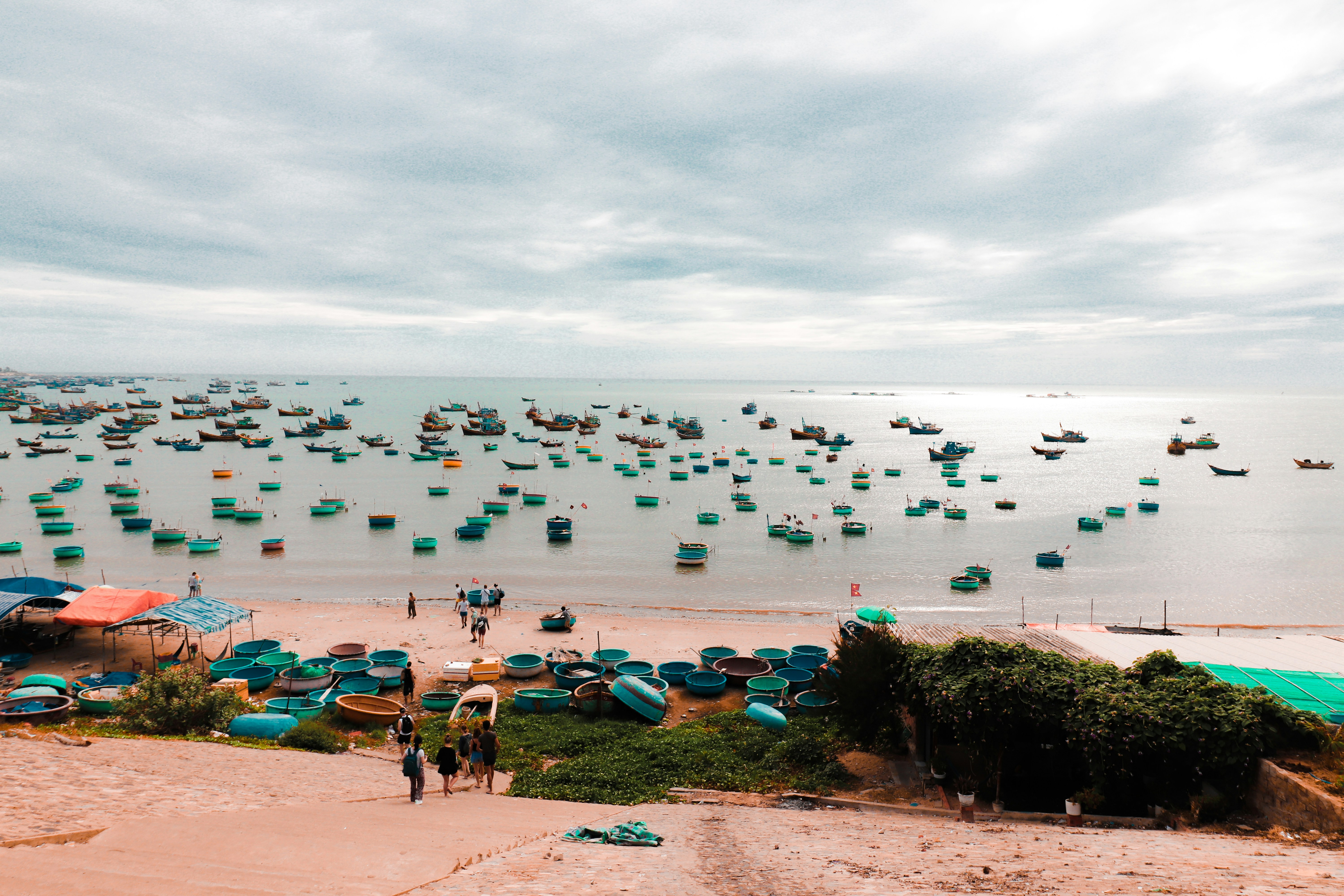 people on beach during daytime, Fishing Village in Mui Ne Vietnam