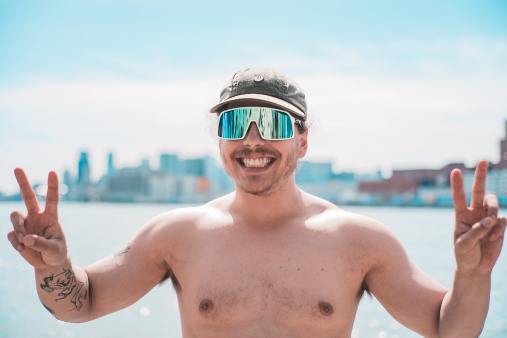 topless man wearing blue and white helmet