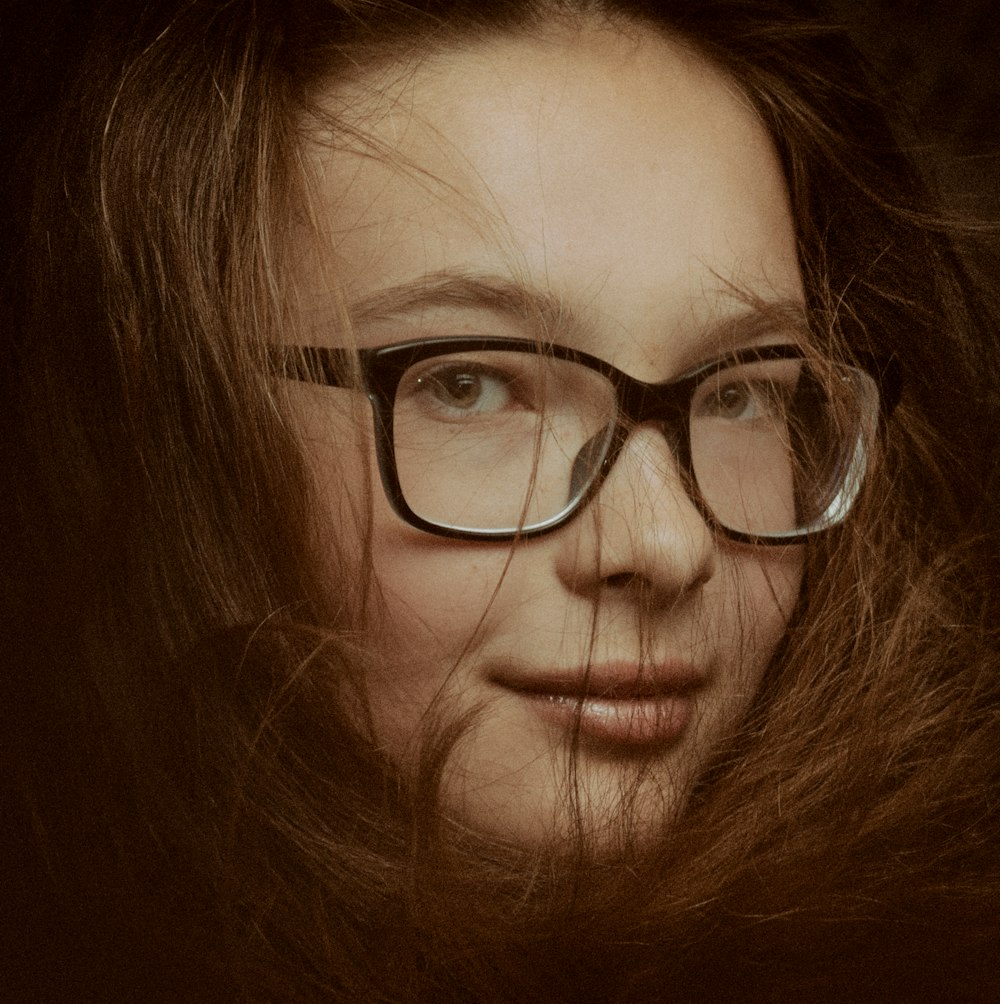 woman wearing black framed eyeglasses