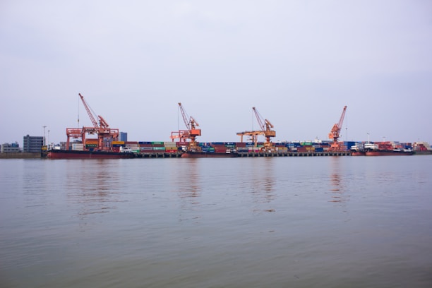 Industrial dock with containers and cranes.